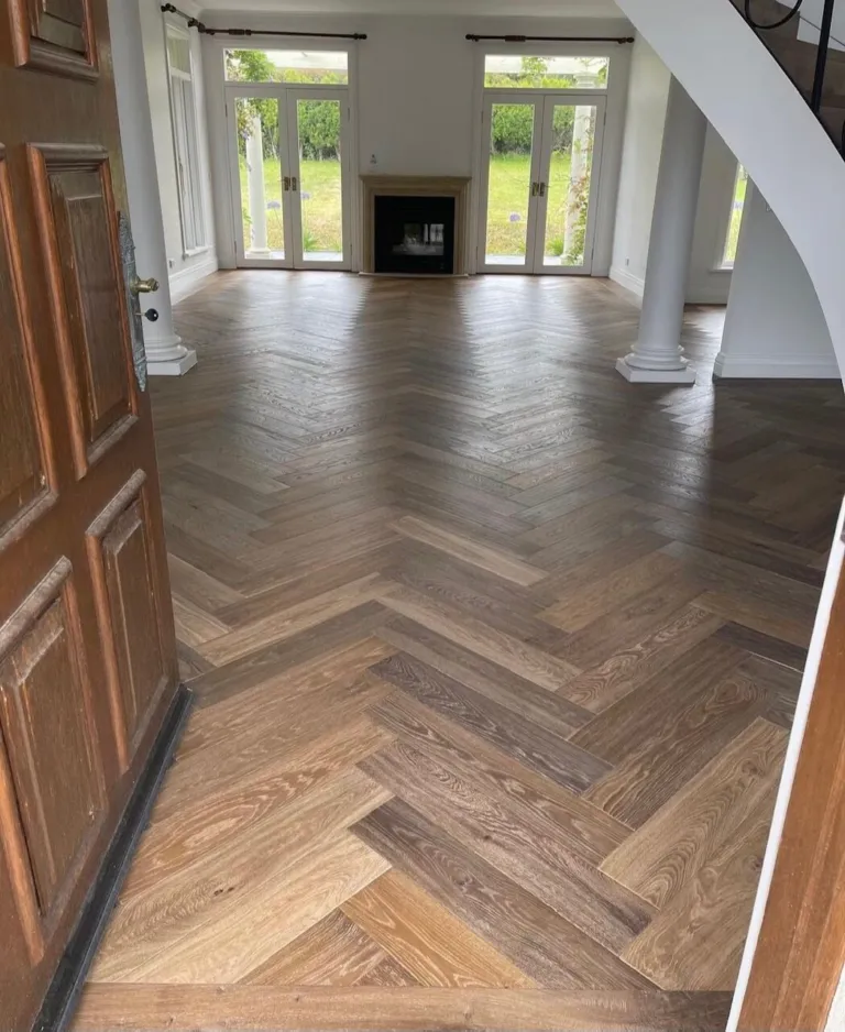 Oak herringbone in a formal room with French doors