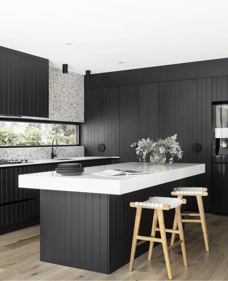 Newhaven Oak boards in a black kitchen with a white stone island