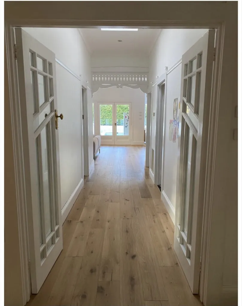 Syracuse Oak running the length of a period hallway through glazed doors