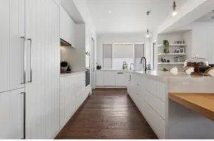 Toran Reclaimed Oak floor in a white shaker-style kitchen