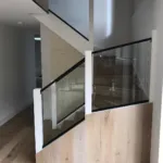 Oak staircase with a frameless glass balustrade