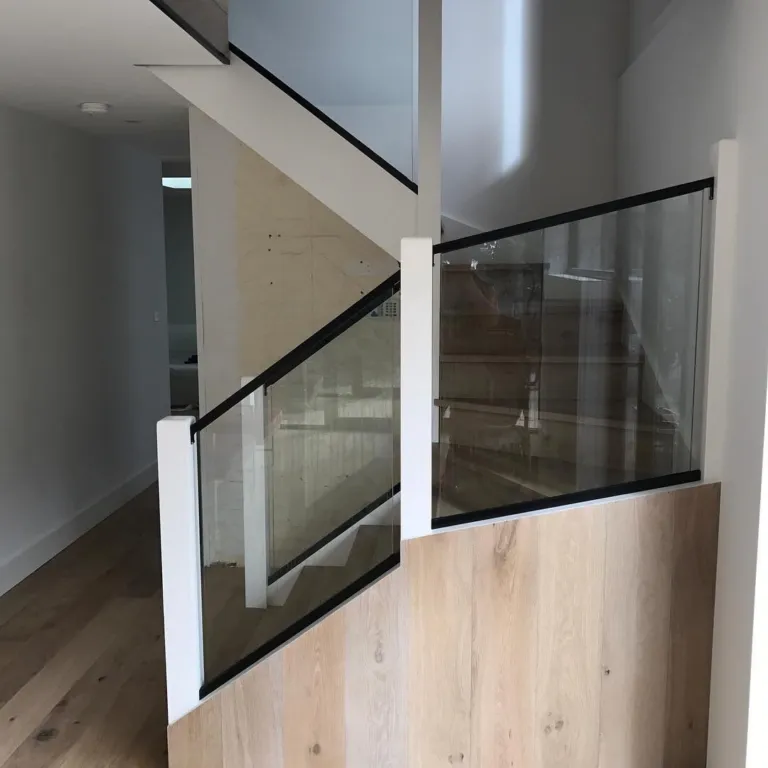 Oak staircase with a frameless glass balustrade