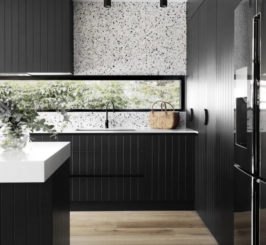 Newhaven Oak floor in a black kitchen with a window splashback