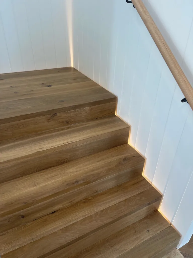 Sherbrooke Oak clad staircase with a timber handrail