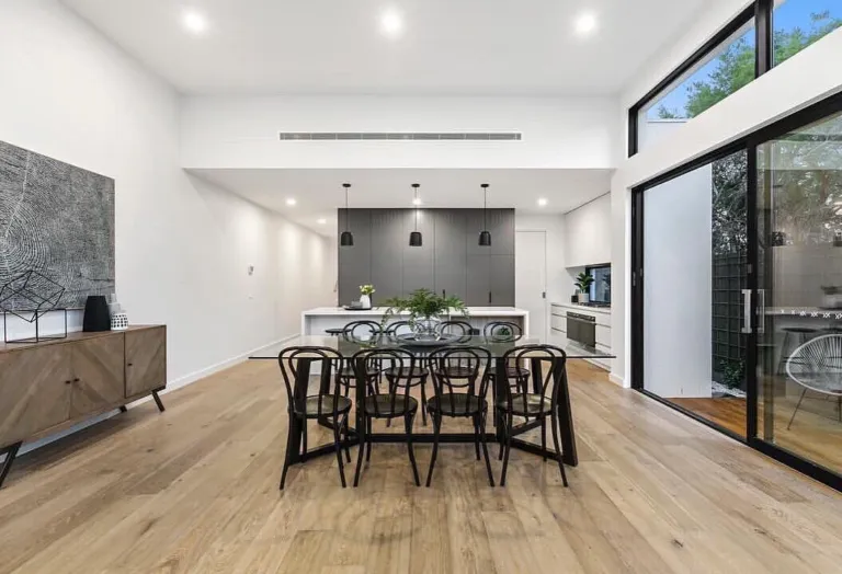 Oak floor under a dining table with bentwood chairs