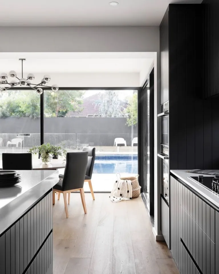Oak kitchen floor looking out to the pool through glass doors