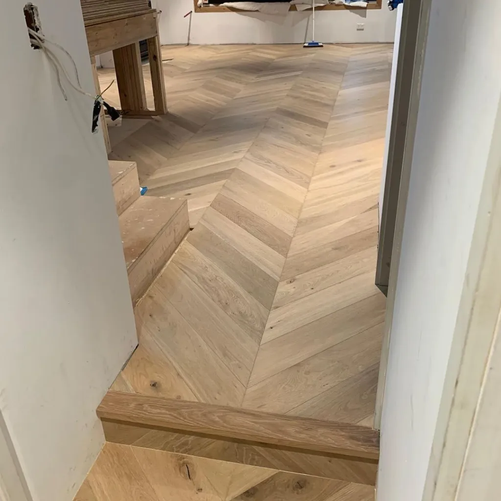 Natural oak herringbone with a matching oak step nosing
